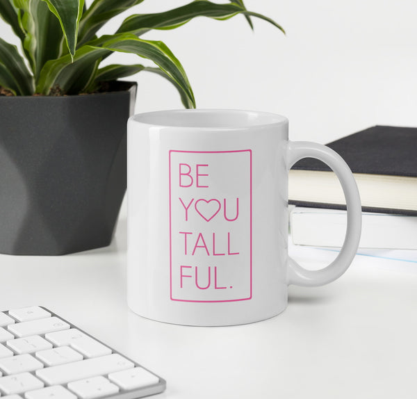 White coffee mug with pink font