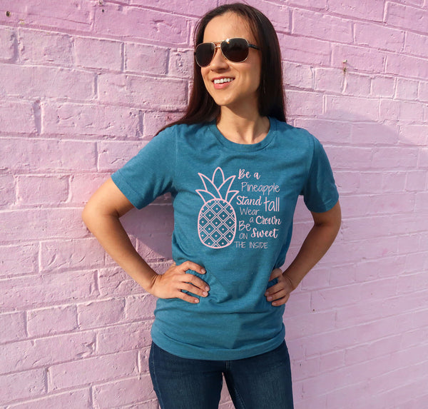 Graphic t-shirt with the quote, "Be a pineapple, stand tall, wear a crown, and be sweet on the inside."
