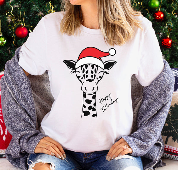 Tall woman wearing a unique holiday t-shirt with a giraffe wearing a Santa hat.