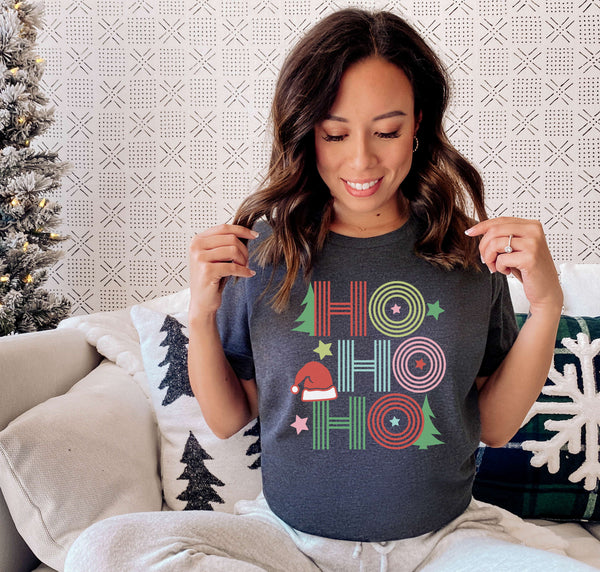 Woman wearing a retro Ho Ho Ho Christmas t-shirt.