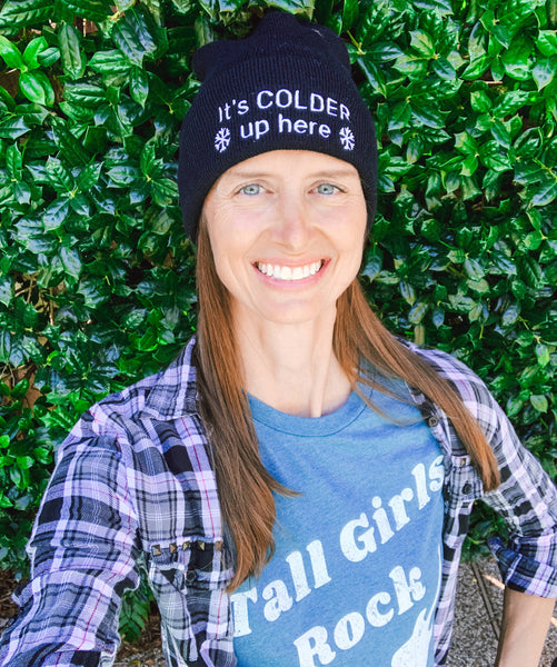 Female wearing a funny beanie for tall women and men.