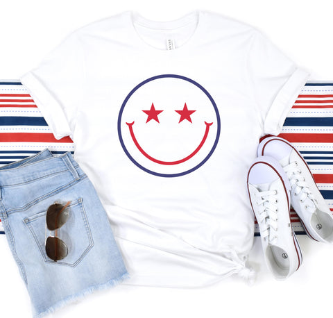 Red, white, and blue star eyes smiley face t-shirt for celebrating country pride.