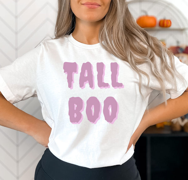 Tall woman wearing a Halloween graphic t-shirt that says "Tall Boo" in a ghost font.
