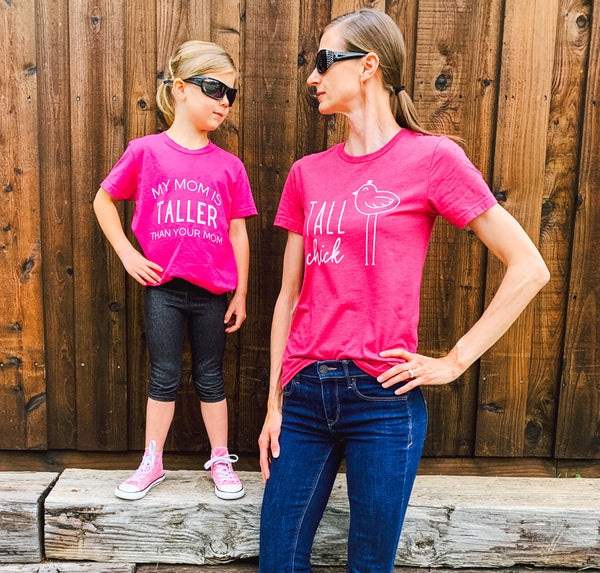 A mom wearing a Tall Chick t-shirt next to her daughter.