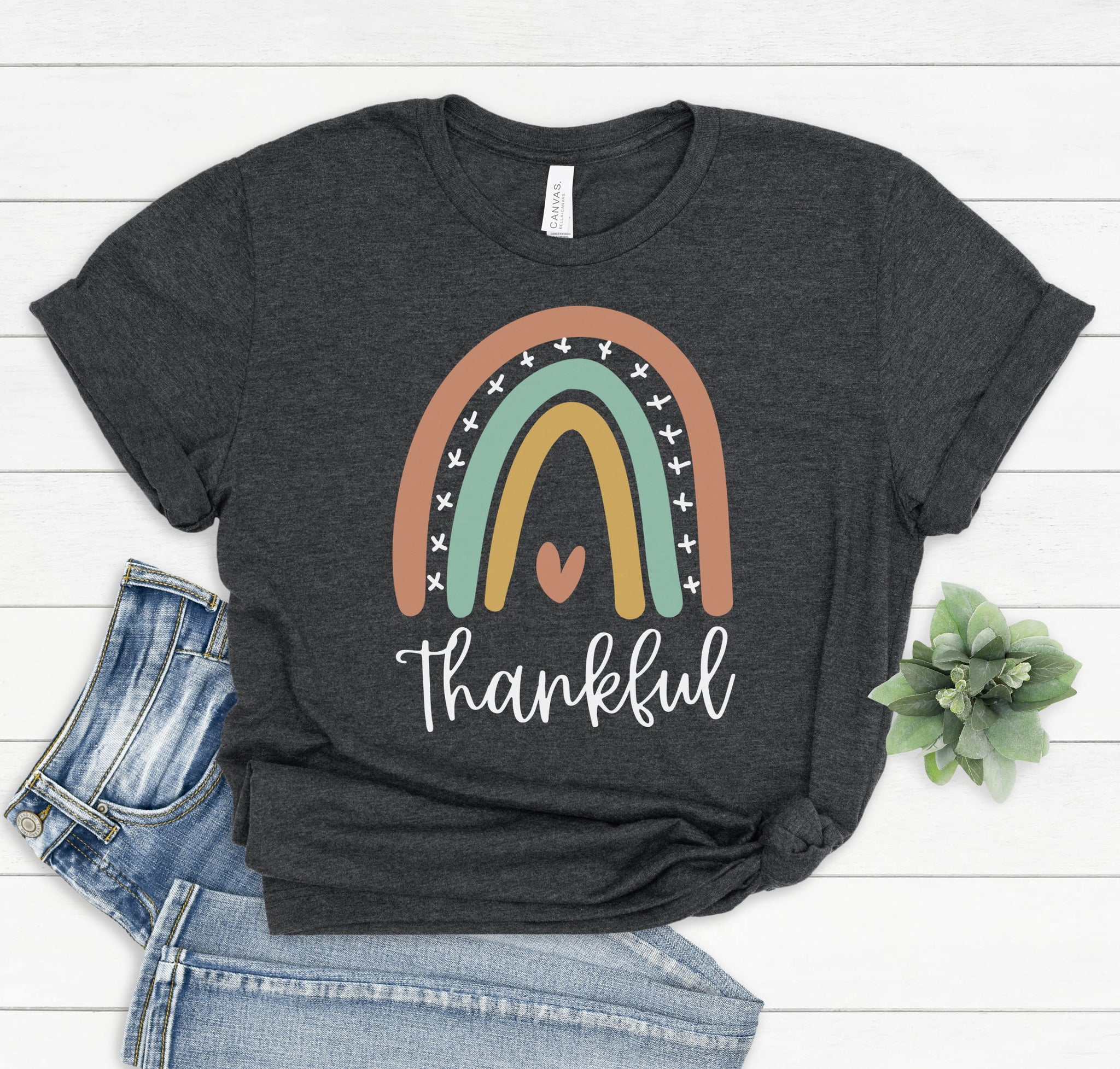 Girls youth graphic t-shirt for fall with a cute rainbow doodle and the word "Thankful" on the front.
